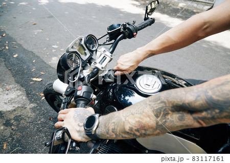 Motorcyclist Closing Fuel tTank Motorcyclist Closing Fuel tTank 83117161