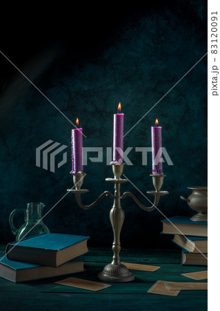 Candle magic. Purple candles and occult books Candle magic. Purple candles and occult books 83120091