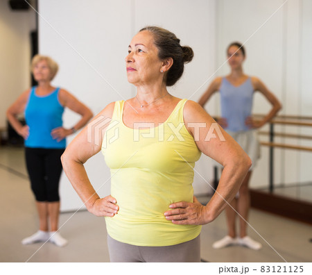 Group of adult people practicing dance techniques 83121125