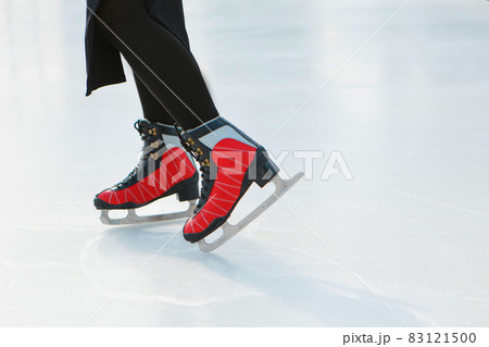 figure skater on ice. the girl is skating. ice under the open sky figure skater on ice. the girl is skating. ice under the open sky 83121500