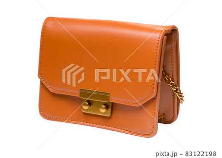small orange leather ladies bag or clutch, with a chain strap, on a white background small orange leather ladies bag or clutch, with a chain strap, on a white background 83122198