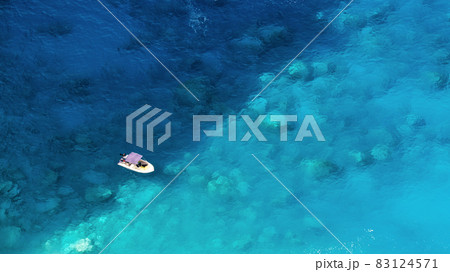 Aerial drone view of moored boat near the coast of Zakynthos, Greece 83124571