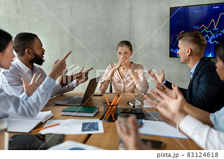 Mobbing At Workplace. Aggressive Coworkers Screaming At Colleague At Meeting In Office 83124618