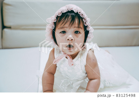 Portrait of Little baby girl wear white hood. Portrait of Little baby girl wear white hood. 83125498