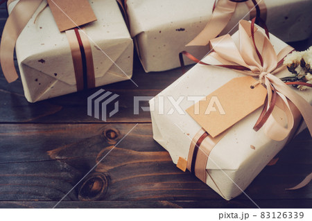Craft gift box on table wooden background with copy space Craft gift box on table wooden background with copy space 83126339
