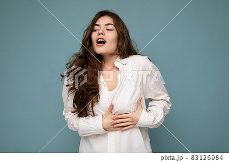 Portrait of young emotional shocked beautiful wave-haired brunette woman with sincere emotions Portrait of young emotional shocked beautiful wave-haired brunette woman with sincere emotions 83126984