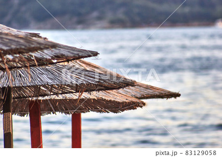 Sun loungers and umbrellas are on the beach in Budva, Montenegro. 83129058