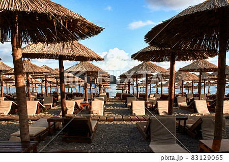 Sun loungers and umbrellas are on the beach in Budva, Montenegro. 83129065