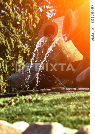 Kvareli, Georgia. Fountains in the form of wine pitcher. Sun flare Kvareli, Georgia. Fountains in the form of wine pitcher. Sun flare 83129097