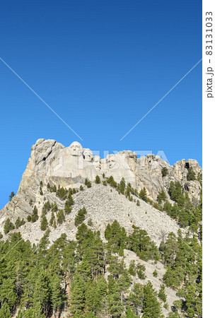 Mount Rushmore National Memorial against the blue sky, South Dakota, USA. Mount Rushmore National Memorial against the blue sky, South Dakota, USA. 83131033