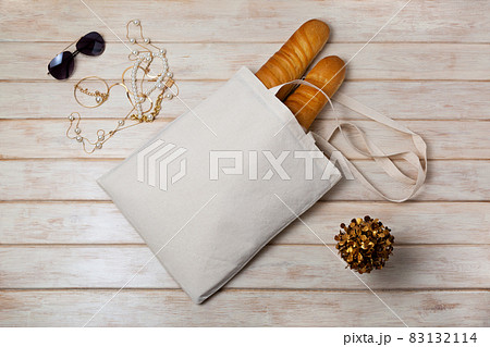 Tote bag mockup with french baguette and sunglasses 83132114