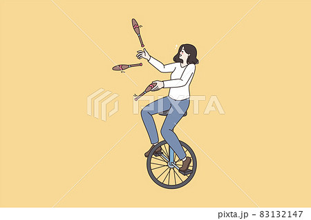 Woman ride unicycle juggle with skittles  83132147