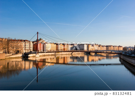 Lyon skyline with footbridge over the Saone river and waterfront buildings France Europe Lyon skyline with footbridge over the Saone river and waterfront buildings France Europe 83132481