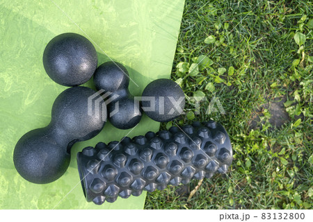 Balls and roller for myofascial relaxation. Equipment for MFR. Tools for self-massage on the grass. Balls and roller for myofascial relaxation. Equipment for MFR. Tools for self-massage on the grass. 83132800