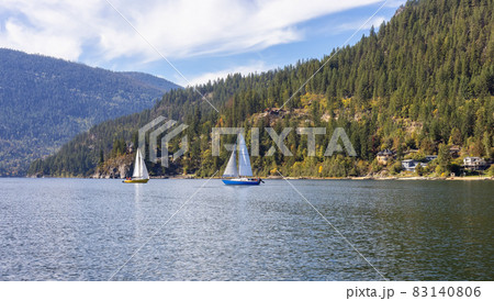 Scenic View of Kootenay River and a small touristic town. Scenic View of Kootenay River and a small touristic town. 83140806