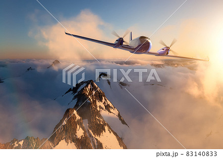 Twin Engine Airplane Flying over the Rocky Mountain Landscape. Twin Engine Airplane Flying over the Rocky Mountain Landscape. 83140833