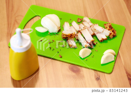 A piece of salted bacon on paper. 83141243