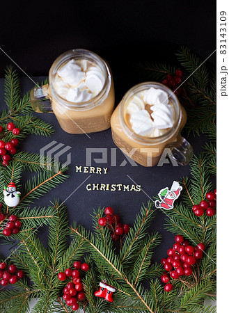 marshmellou hot cocoa trees in the background. The inscription Merry Christmas marshmellou hot cocoa trees in the background. The inscription Merry Christmas 83143109