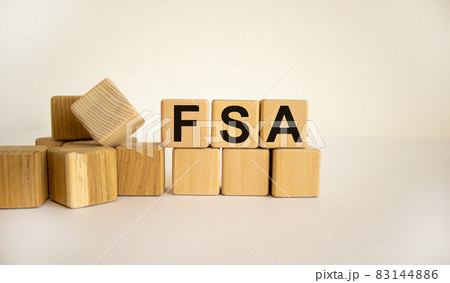 FSA symbol. Concept word 'FSA - flexible spending account' on cubes on a beautiful white background. Business and FSA - flexible spending account concept. Copy space. 83144886