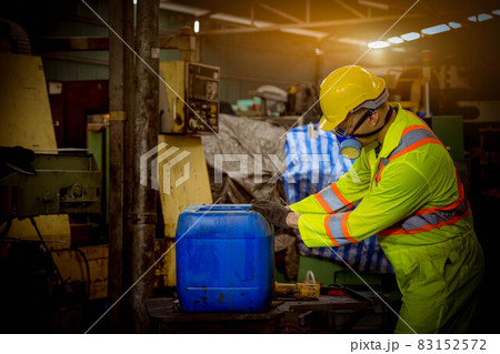 Engineer industry wearing safety uniform ,black gloves ,gas mask feel suffocate when under checking chemical tank in industry factory work. Engineer industry wearing safety uniform ,black gloves ,gas mask feel suffocate when under checking chemical tank in industry factory work. 83152572