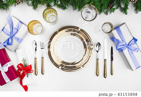 Close up beautiful Christmas table setting with decorations Close up beautiful Christmas table setting with decorations 83153898