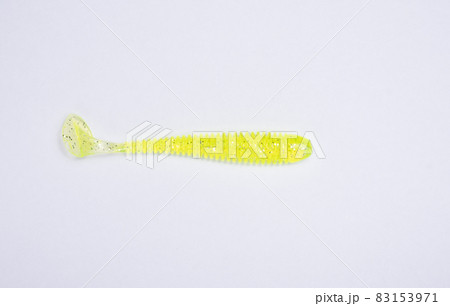 Colored jig head, ready to use bait.The fake worms are made of silicone that are used to hook them.Worm silicone on white background. Colored jig head, ready to use bait.The fake worms are made of silicone that are used to hook them.Worm silicone on white background. 83153971