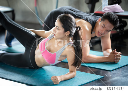 FITNESS AND WORKING OUT concept. Active lifestyle of Young people exercise and workout at fitness gym. FITNESS AND WORKING OUT concept. Active lifestyle of Young people exercise and workout at fitness gym. 83154134
