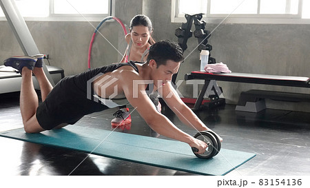FITNESS AND WORKING OUT concept. Active lifestyle of Young people exercise and workout at fitness gym. 83154136