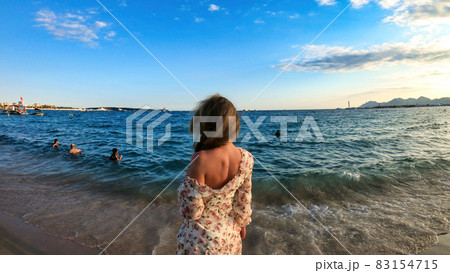 Woman on the beach in Cannes, France Woman on the beach in Cannes, France 83154715