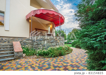 Horizontal view of single-family home with patio 83154835