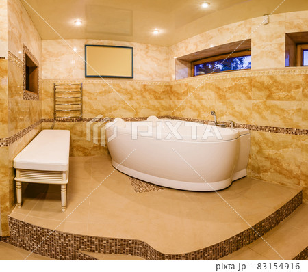 interior modern house, bathroom with marble tiles and jacuzzi interior modern house, bathroom with marble tiles and jacuzzi 83154916