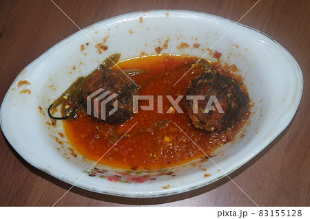 Top view of meat balls or meat kofta curry in masala gravy in a ceramic plate 83155128