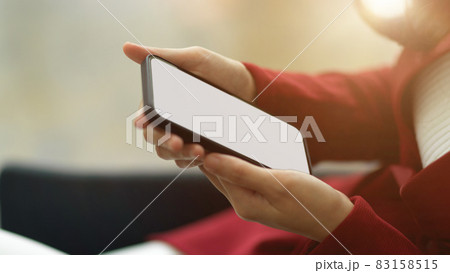 Side view and focused businesswoman hands using, holding smart mobile phone Side view and focused businesswoman hands using, holding smart mobile phone 83158515