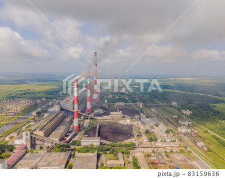 plant pipe with smoke against blue sky 83159636