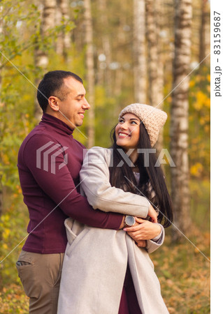 Lovely couple having fun together in nature. Lovely couple having fun together in nature. 83159687