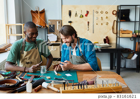 Two Men Enjoying Work in Workshop 83161621