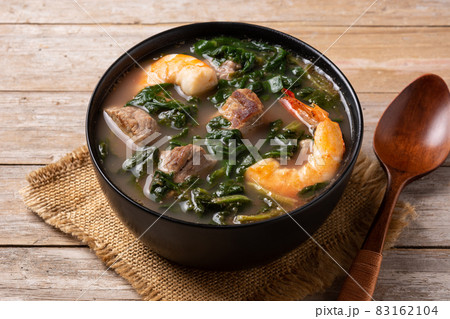 Beef, okra stew and spinach soup in bowl 83162104
