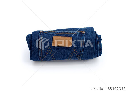 Rolled blue jeans on white background Rolled blue jeans on white background 83162332