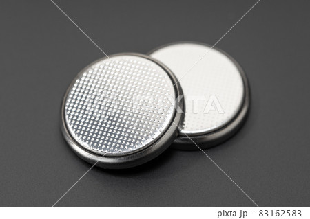 Button cell battery or coin cell isolated on black background Button cell battery or coin cell isolated on black background 83162583