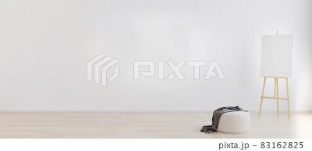 Easel with canvas in bright white room for mockup. Artist workspace concept. Empty bright room interior for mockup. Room with white wall and wooden flooring. 3d rendering Easel with canvas in bright white room for mockup. Artist workspace concept. Empty bright room interior for mockup. Room with white wall and wooden flooring. 3d rendering 83162825