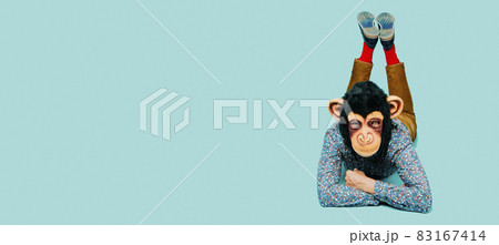monkey man lying face down, web banner 83167414