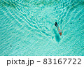 Top down view of a girl swimming in a lagoon 83167722