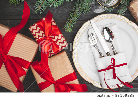 Black wooden table with stylish Christmas table setting Black wooden table with stylish Christmas table setting 83169838