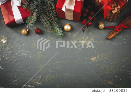 Wooden background copy space with christmas gifts and decorations for your design Wooden background copy space with christmas gifts and decorations for your design 83169855