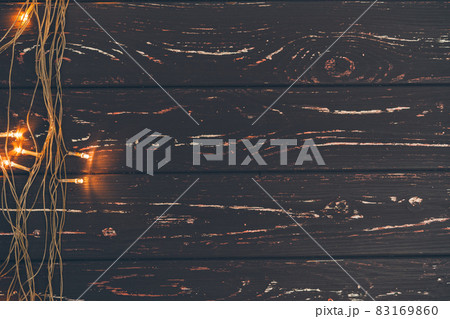 Christmas garland on wooden background with copy space Christmas garland on wooden background with copy space 83169860