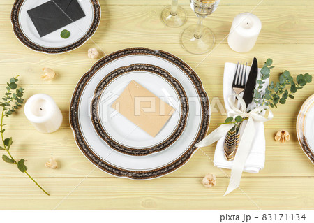 Table with plates and cutlery, view from above Table with plates and cutlery, view from above 83171134