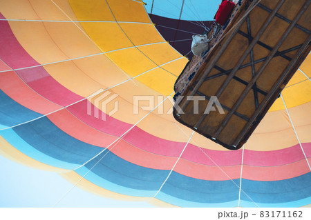 colorful rainbow patterned hot air balloon rising up colorful rainbow patterned hot air balloon rising up 83171162