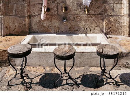 closeup of bronze water faucets near a Muslim mosque closeup of bronze water faucets near a Muslim mosque 83171215