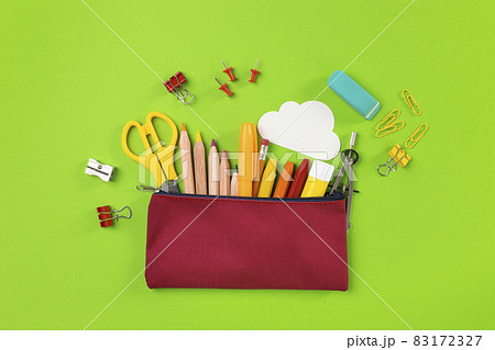 Back to school concept. Pencil case on green background Back to school concept. Pencil case on green background 83172327