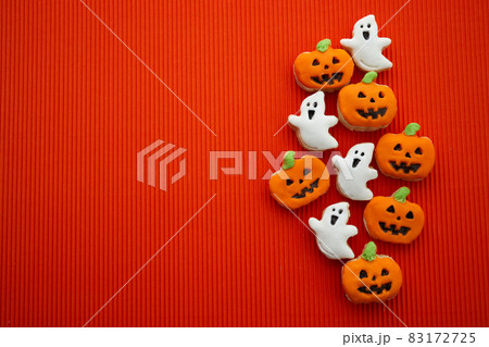 Halloween gingerbread cookies on orange background. The hand made gingerbread Halloween pumpkin and ghost 83172725